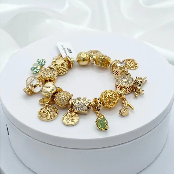 Linx Yellow Gold Bracelet with Gold and Green Themed Charms